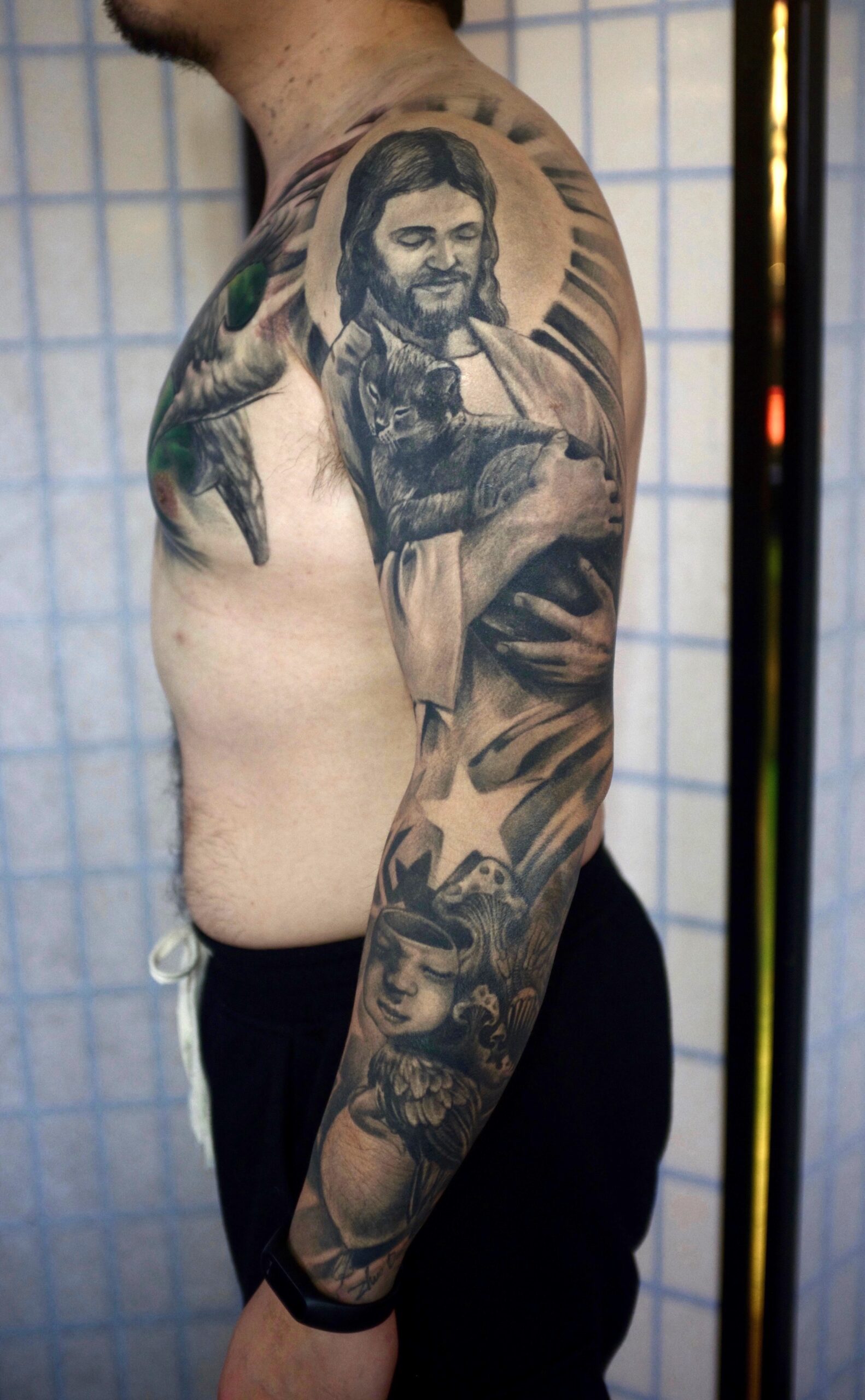 zhuo dan ting tattoo work 卓丹婷纹身作品 耶稣和猫花臂纹身 1